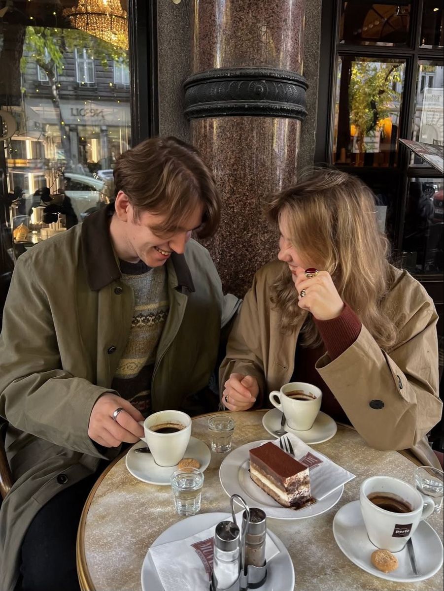 Two people laughing together on a social date